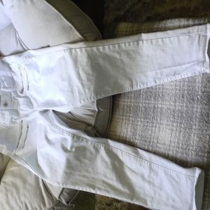 A pair of white gently worn size 12 high rise skinny jeans
